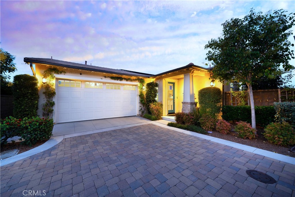 a front view of house with yard and trees