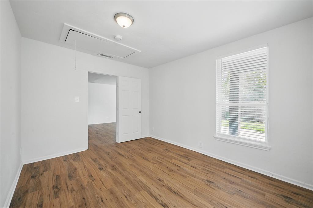210 North 5th Avenue Denison, TX 75021 - Photo 17 of 20 a view of empty room with wooden floor and fan