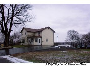 13 Rutledge Street Pittston, PA 18640 - Photo 1 of 2 a view of a house with a yard