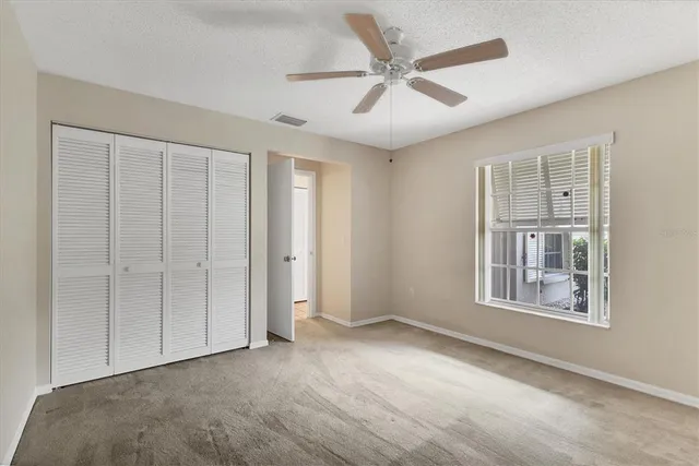 a view of empty room with windows and yard