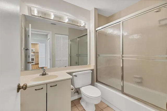 a view of a porch with wooden floor and a yard