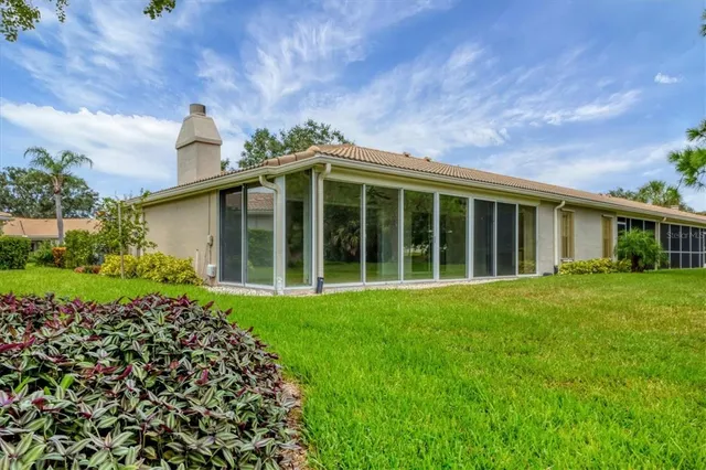 a aerial view of a house with a yard