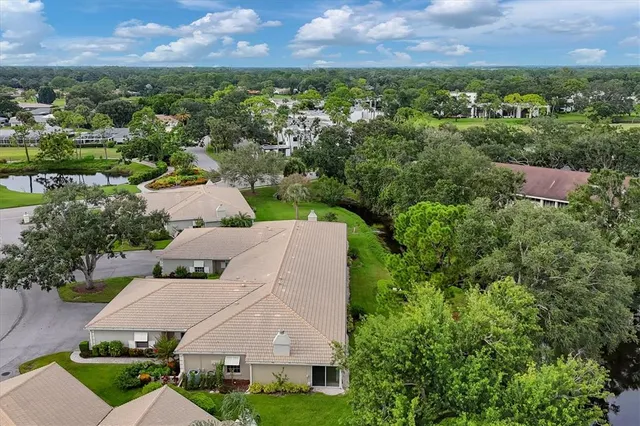 a view of a swimming pool with a table and chairs
