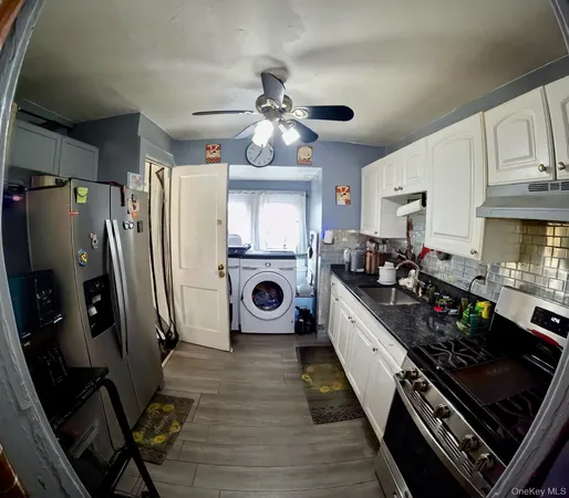 a kitchen with stainless steel appliances a stove a refrigerator and cabinets
