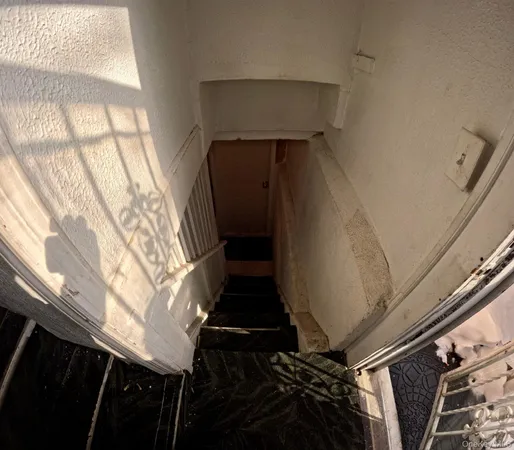 a view of a hallway with seating area