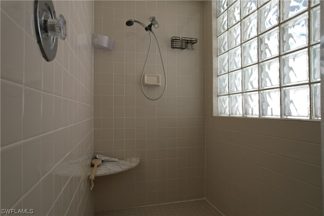 9805 Maplecrest Circle Lehigh Acres, FL 33936 - Photo 19 of 38 a bathroom with a shower