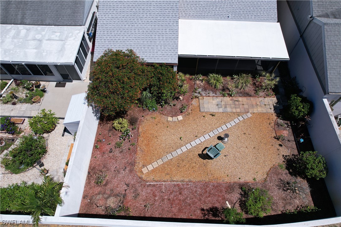 9805 Maplecrest Circle Lehigh Acres, FL 33936 - Photo 20 of 38 an aerial view of a backyard