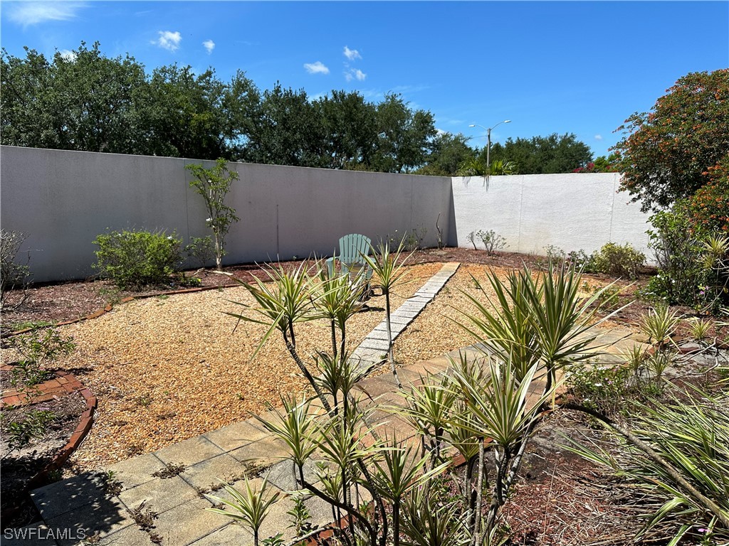 9805 Maplecrest Circle Lehigh Acres, FL 33936 - Photo 33 of 38 a view of outdoor space and yard