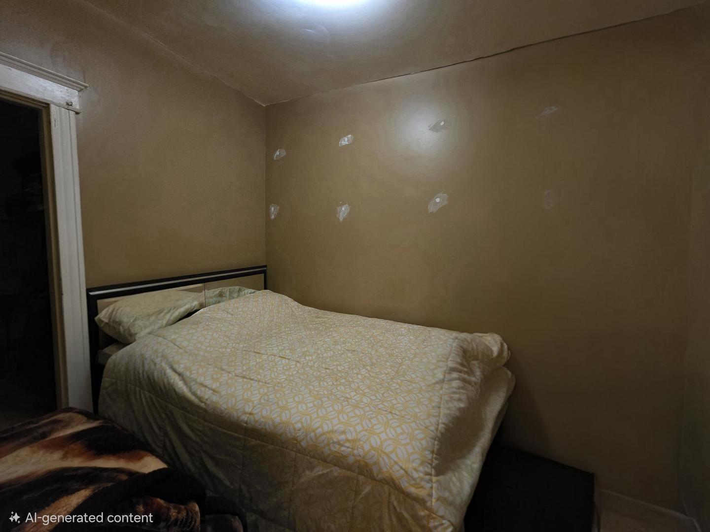 3902 West Fillmore Street Chicago, IL 60624 - Photo 13 of 18 a bed sitting in a bedroom next to a bathroom