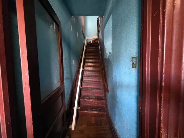 a view of a hallway with a door