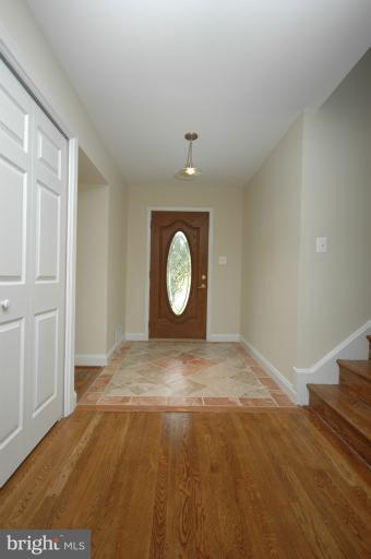 13207 Tamarack Road Silver Spring, MD 20904 - Photo 13 of 24 a view of an empty room with window and wooden floor