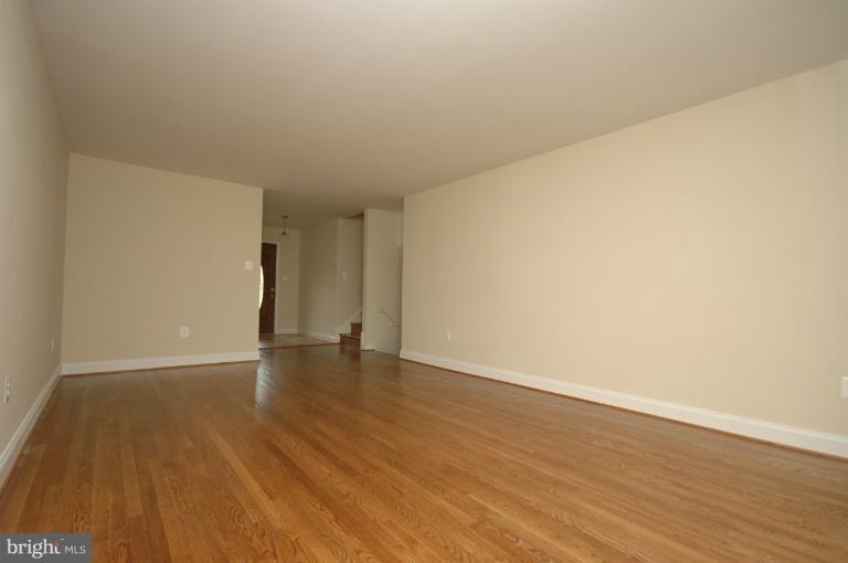 13207 Tamarack Road Silver Spring, MD 20904 - Photo 16 of 24 a view of an empty room and wooden floor