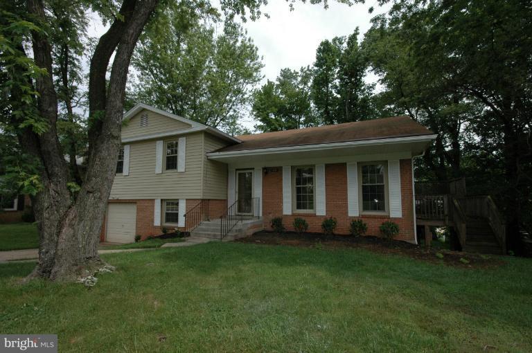 13207 Tamarack Road Silver Spring, MD 20904 - Photo 24 of 24 a front view of a house with a garden and trees