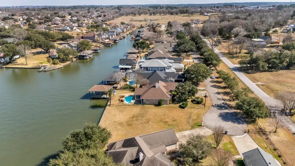 an aerial view of a house with a lake view
