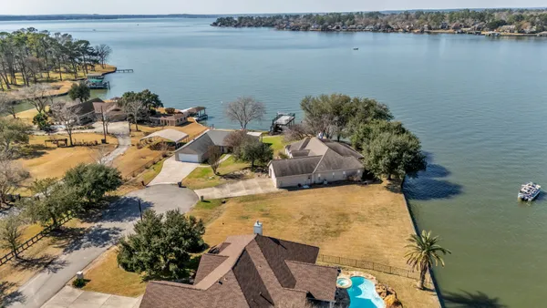 an aerial view of a house with a yard