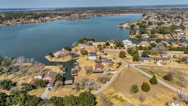 an aerial view of a house with a lake view