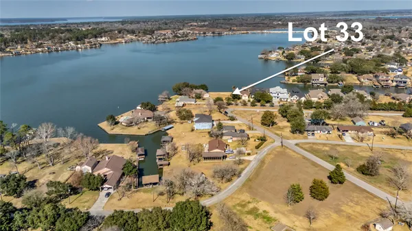 an aerial view of a houses with ocean view
