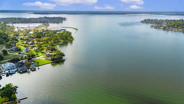 an aerial view of a houses with ocean view