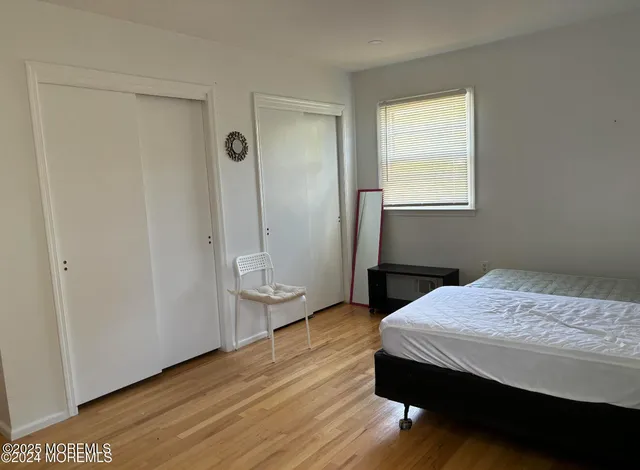 a bedroom with a bed and a table