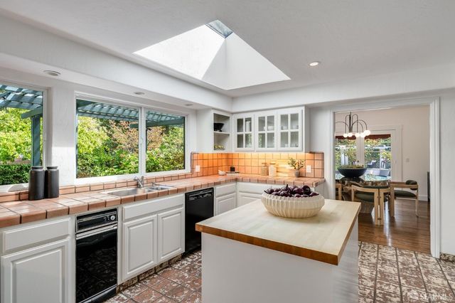 a bedroom with a large bed and a large window