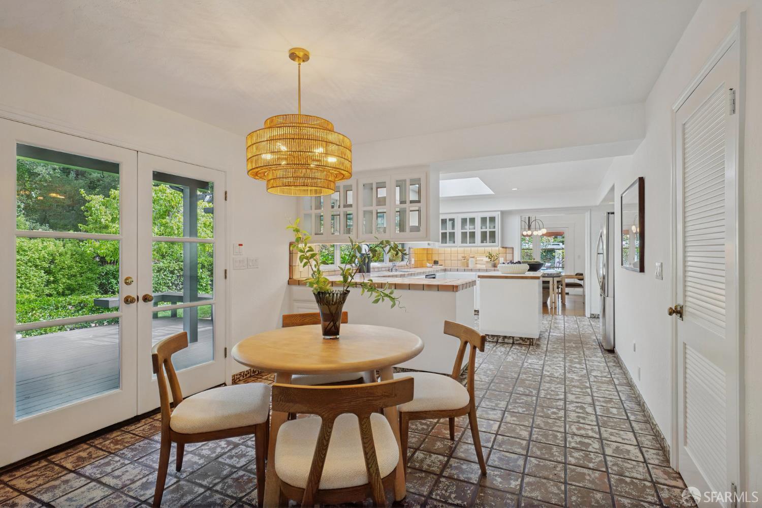 16244 Kennedy Road Los Gatos, CA 95032 - Photo 15 of 67 a kitchen with a dining table and chairs