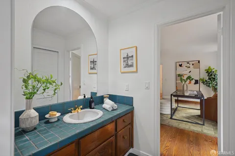 a aerial view of a house with a yard table and chairs