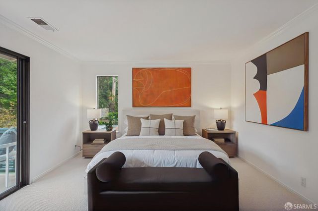 a view of a patio with a table and chairs