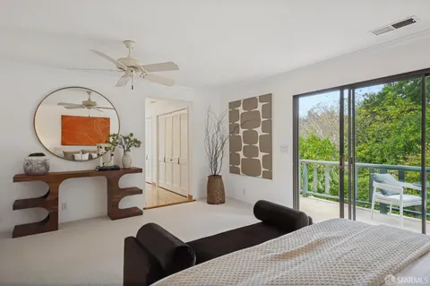 an aerial view of a house with garden space sitting space and trees all around