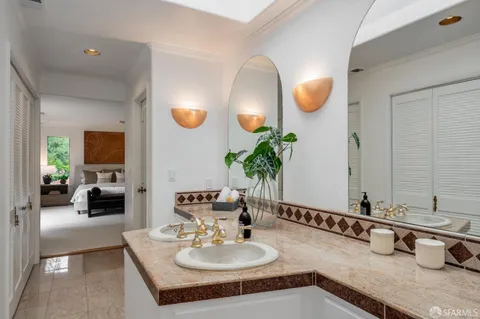 a view of a house with a yard and potted plants