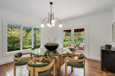 a kitchen with a dining table and chairs