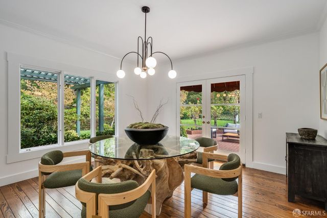 a kitchen with a dining table and chairs