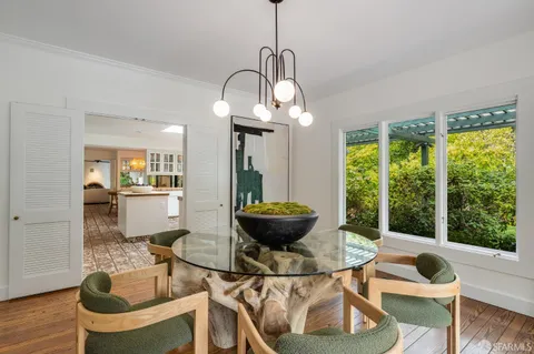 a bedroom with a bed window and couch