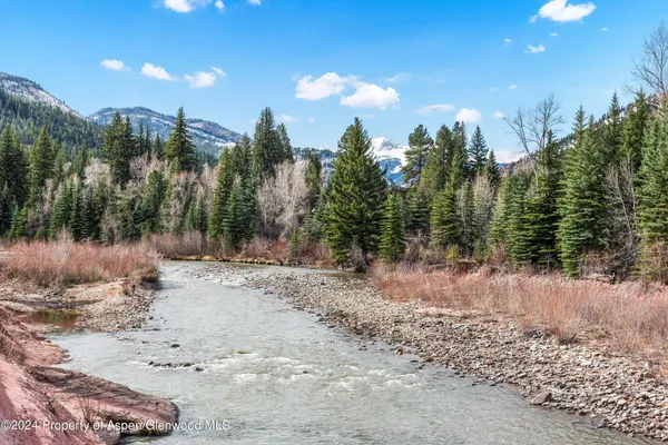 a view of a building with a tree in front of it