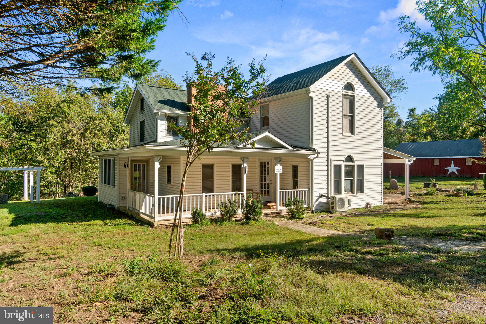 10819 Shanktown Road Big Pool, MD 21711 - Photo 19 of 79 a front view of a house with a yard table and chairs