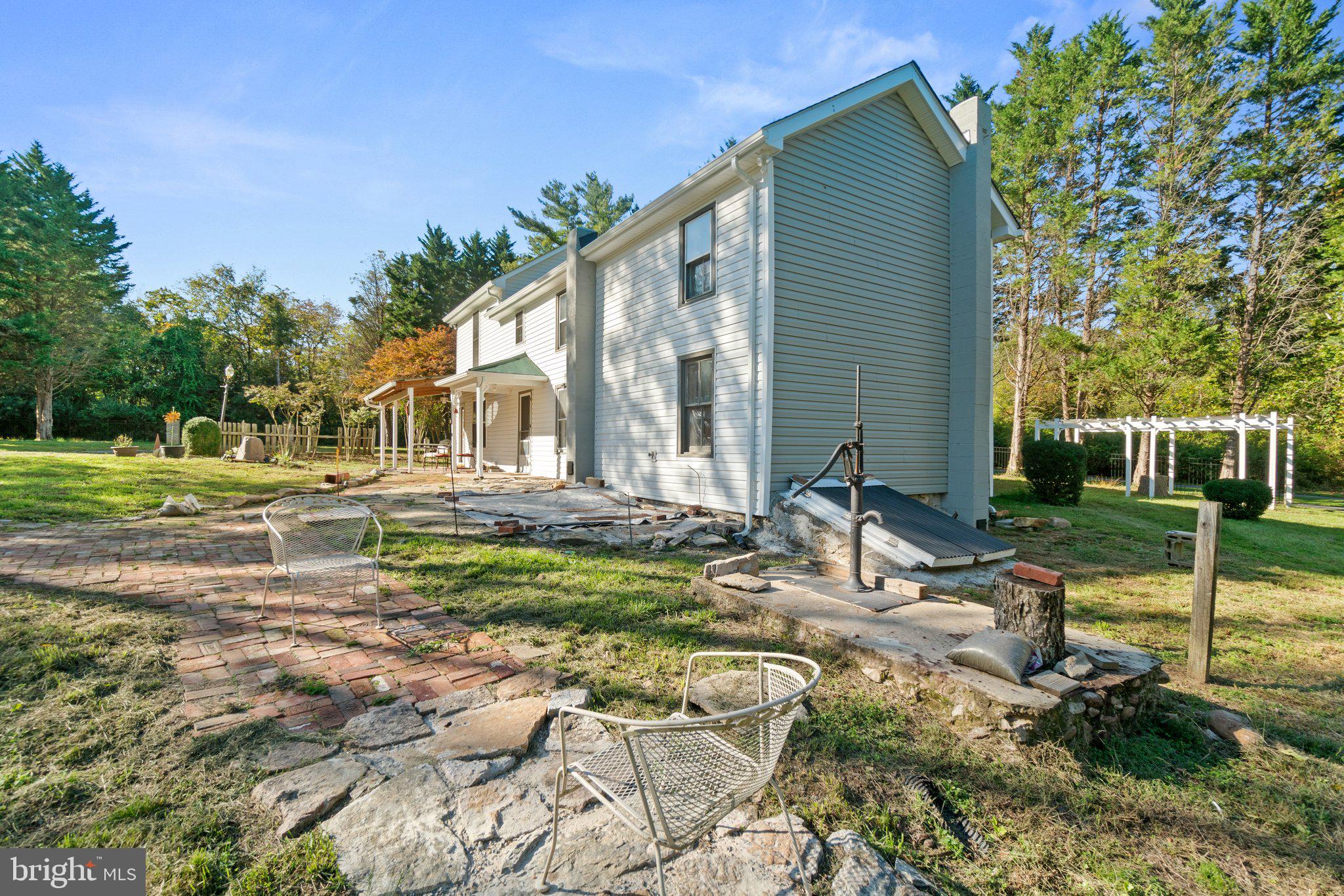 10819 Shanktown Road Big Pool, MD 21711 - Photo 26 of 79 a backyard of a house with barbeque oven table and chairs