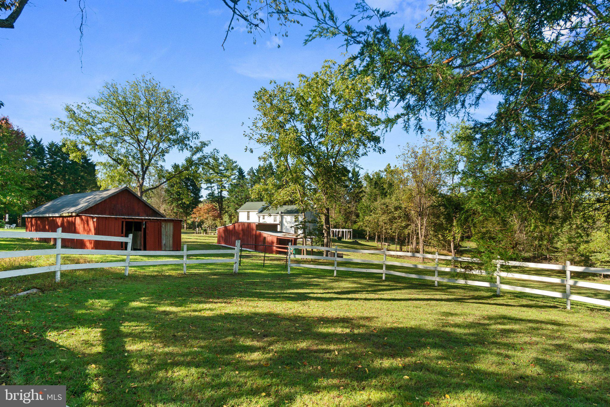 10819 Shanktown Road Big Pool, MD 21711 - Photo 33 of 79 a swimming pool with some trees in the background