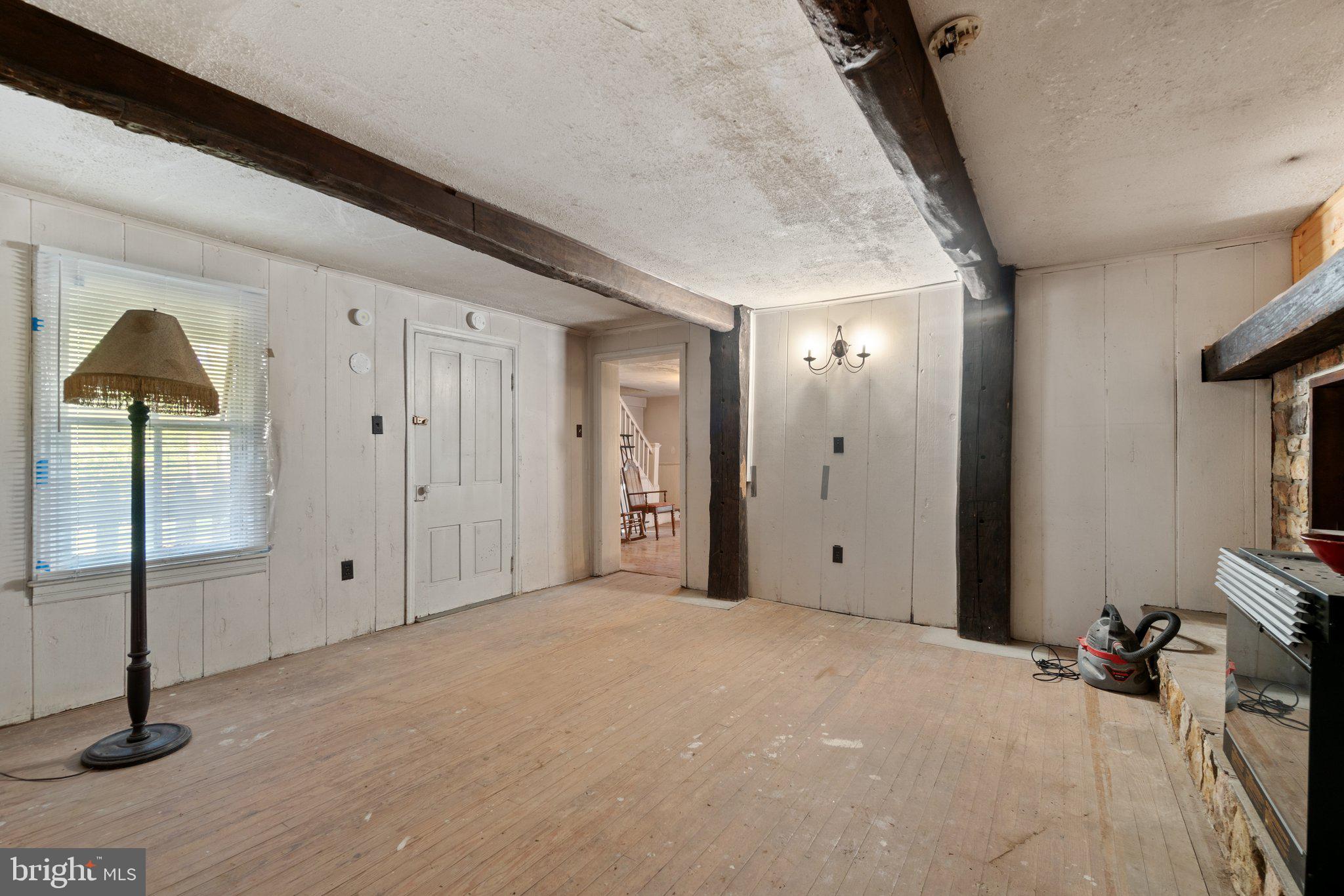 10819 Shanktown Road Big Pool, MD 21711 - Photo 64 of 79 a view of a room with an empty space and wooden floor