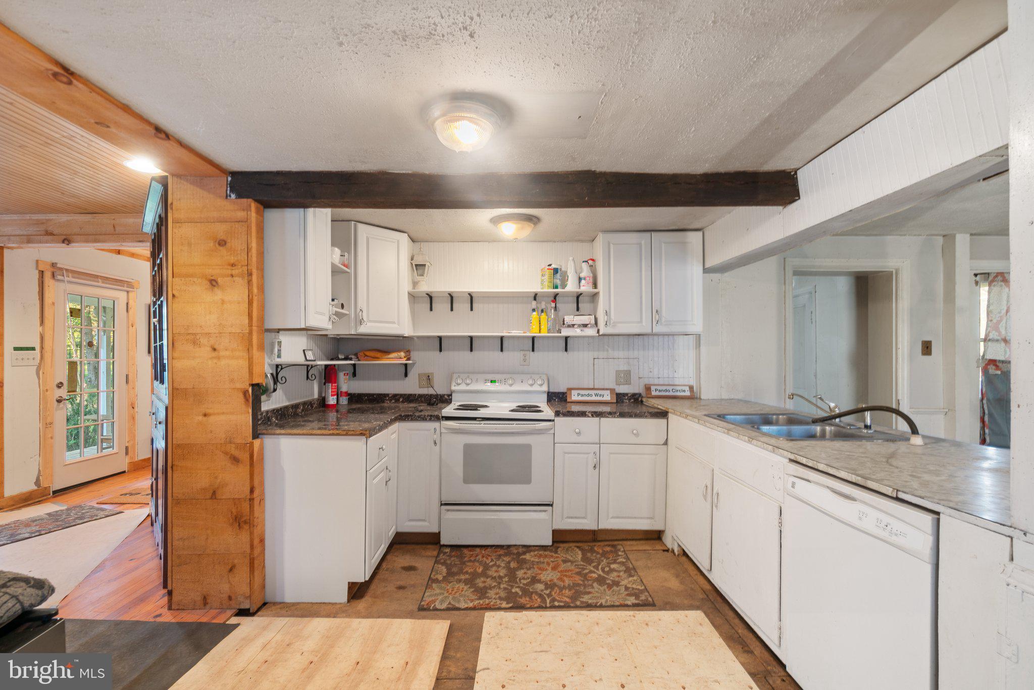 10819 Shanktown Road Big Pool, MD 21711 - Photo 66 of 79 a kitchen with a sink stove top oven and cabinets
