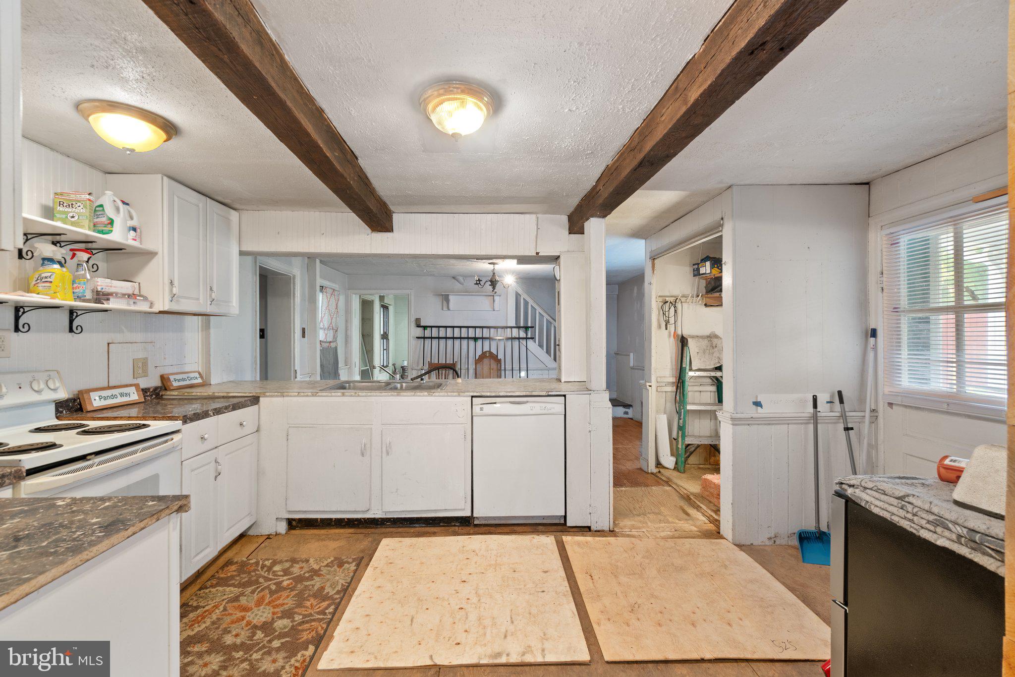 10819 Shanktown Road Big Pool, MD 21711 - Photo 67 of 79 a kitchen with white cabinets and appliances