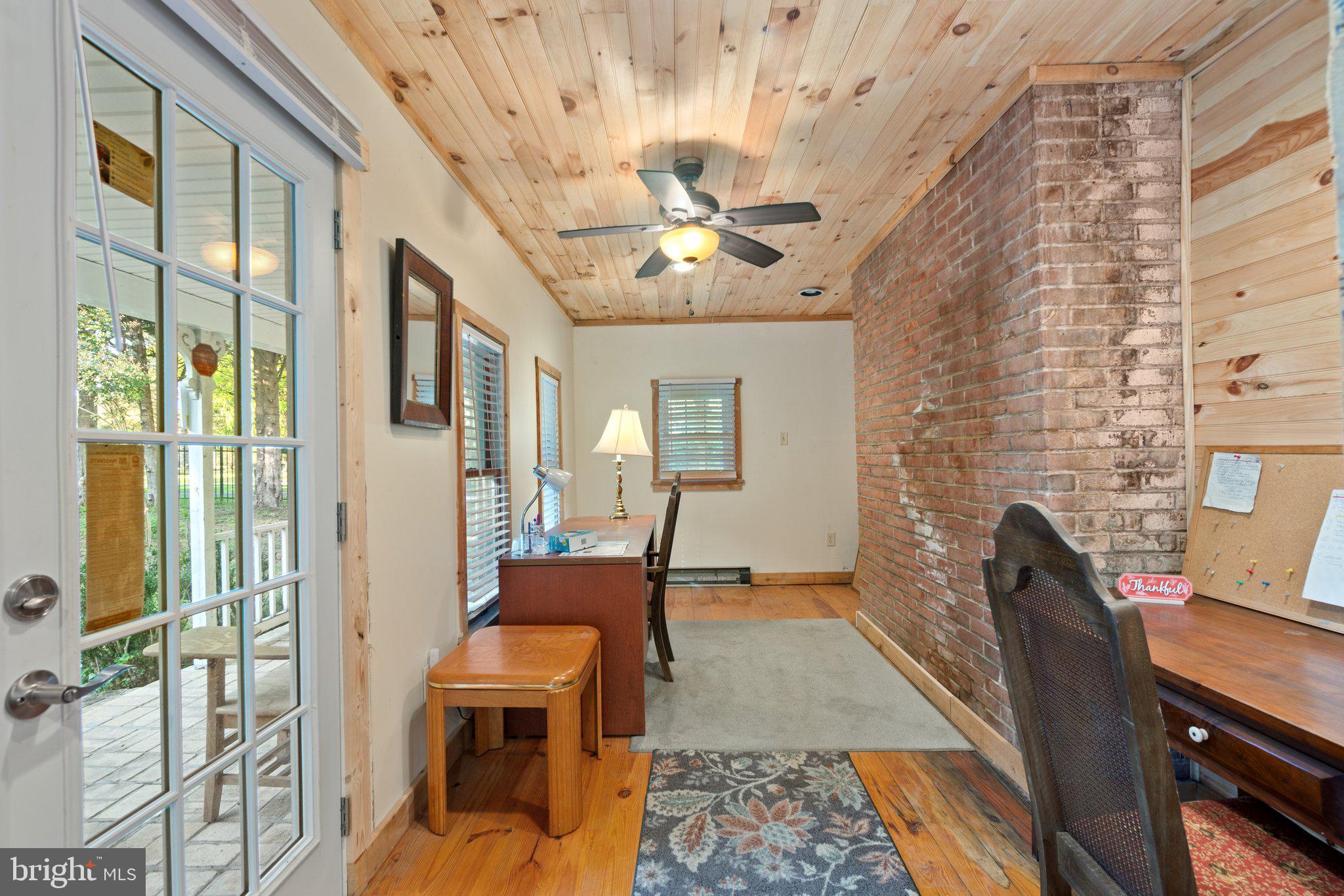 10819 Shanktown Road Big Pool, MD 21711 - Photo 72 of 79 a dining room with furniture and a chandelier