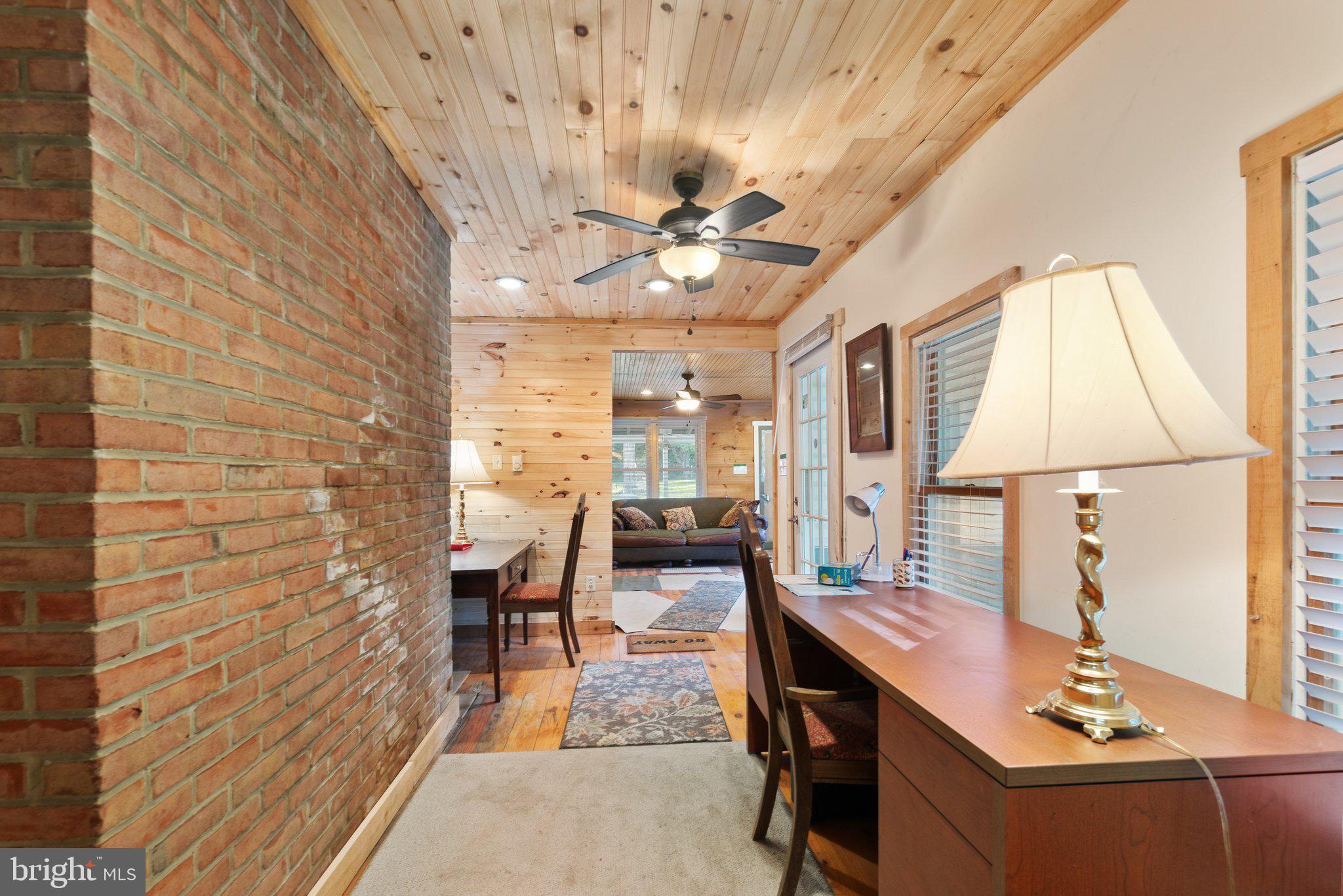 10819 Shanktown Road Big Pool, MD 21711 - Photo 73 of 79 a dining room with furniture and a chandelier