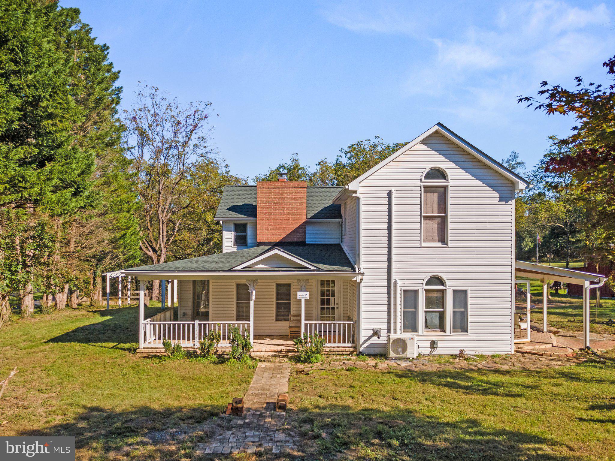 10819 Shanktown Road Big Pool, MD 21711 - Photo 9 of 79 a front view of a house with a yard