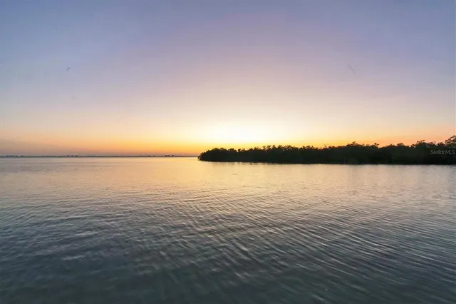 a view of a livingroom with furniture and a fireplace