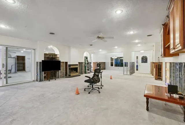 a view of a livingroom with an empty space and balcony
