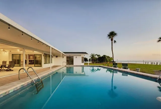 a view of a swimming pool with a lake view