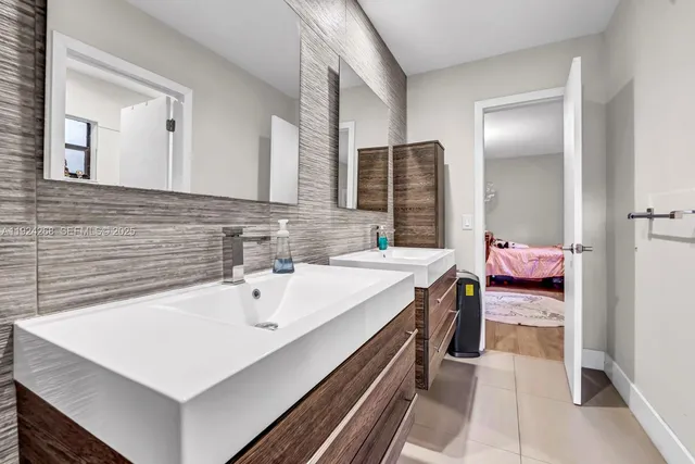 a bathroom with a sink and a mirror