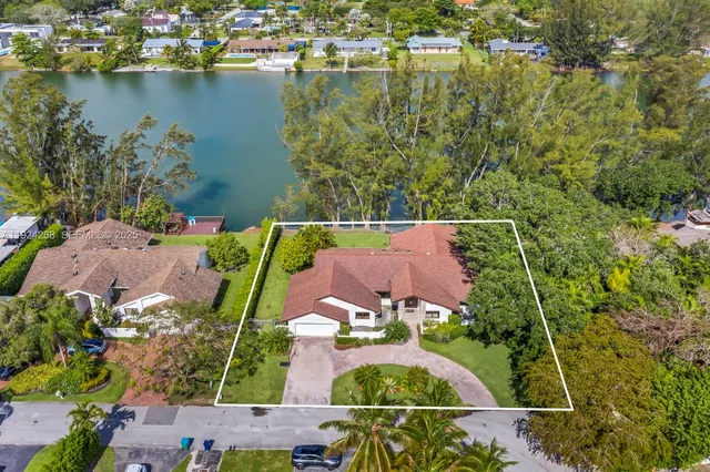 an aerial view of houses with yard