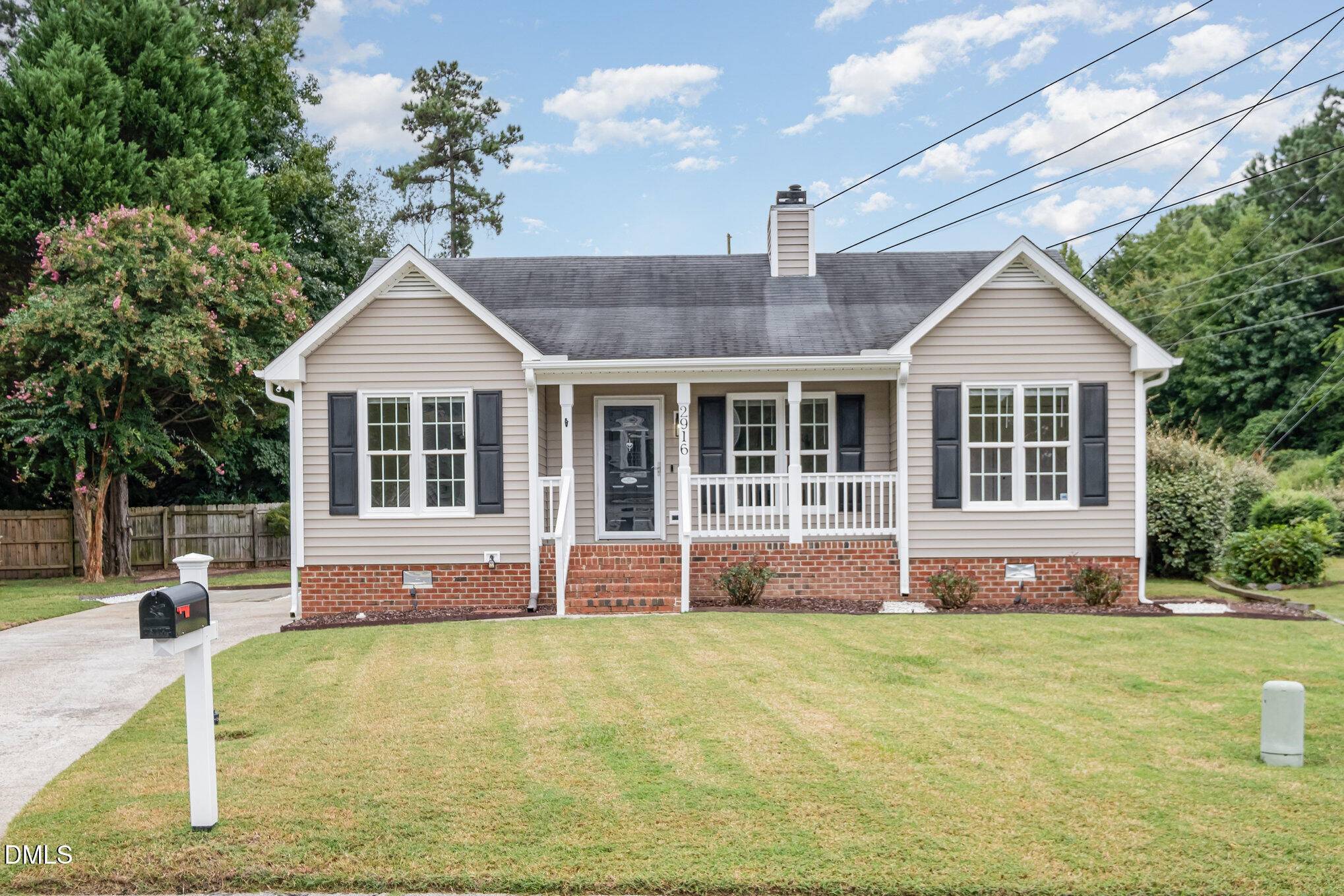 2916 Bannf Court Raleigh, NC 27604 - Photo 1 of 31 a front view of a house with a garden and porch