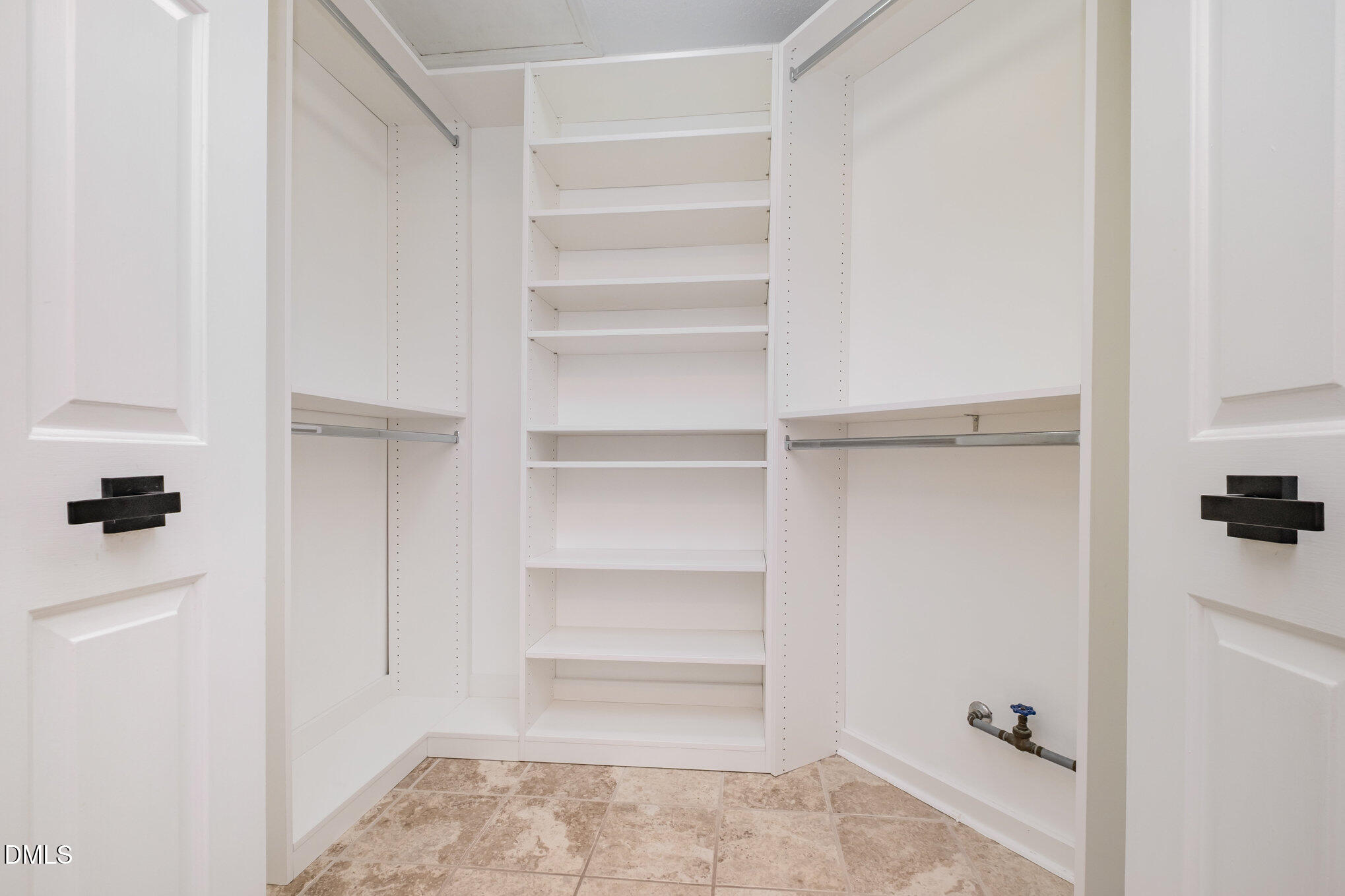2916 Bannf Court Raleigh, NC 27604 - Photo 15 of 31 a view of walk in closet with empty racks