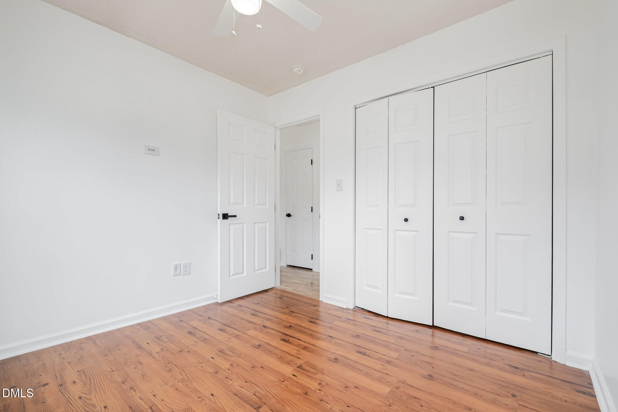 2916 Bannf Court Raleigh, NC 27604 - Photo 17 of 31 a view of an empty room with wooden floor